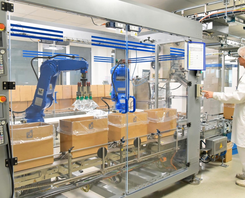Worker overseeing packaging process of manufacturing
