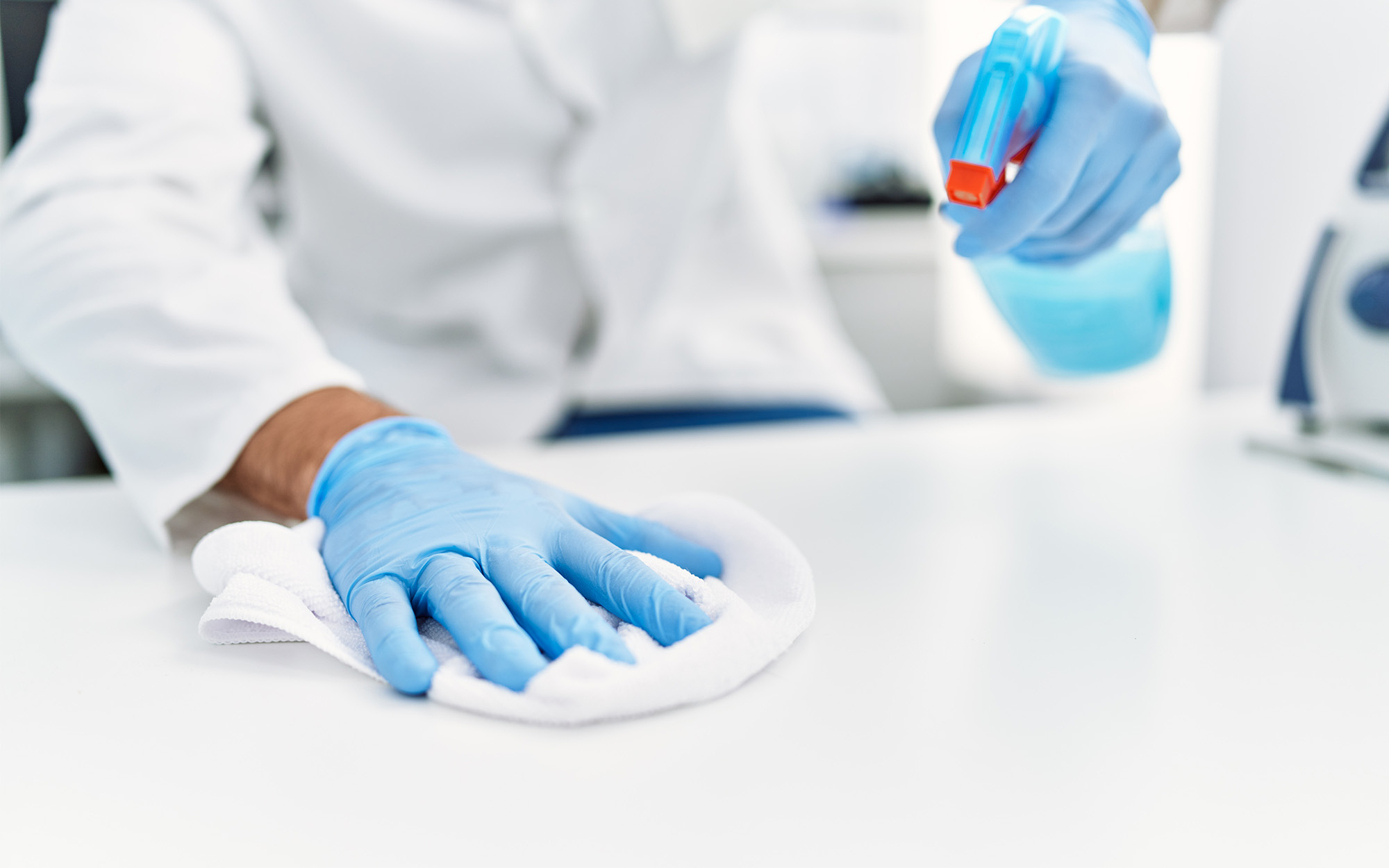 man working as scientific cleaning the table at laboratory man working as scientific cleaning the table at laboratory