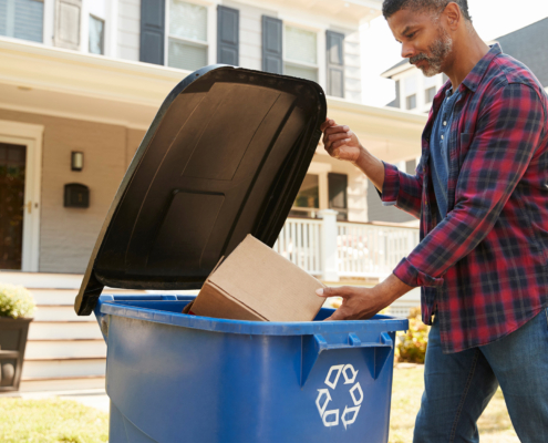 Person throwing packaging in recycle