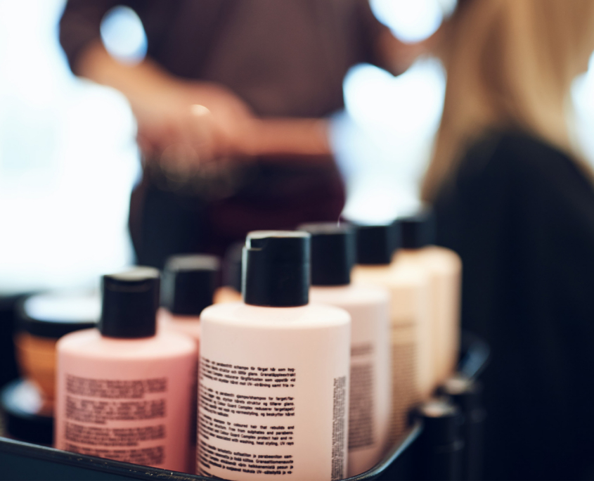 Bottles of styling products in a hair salon